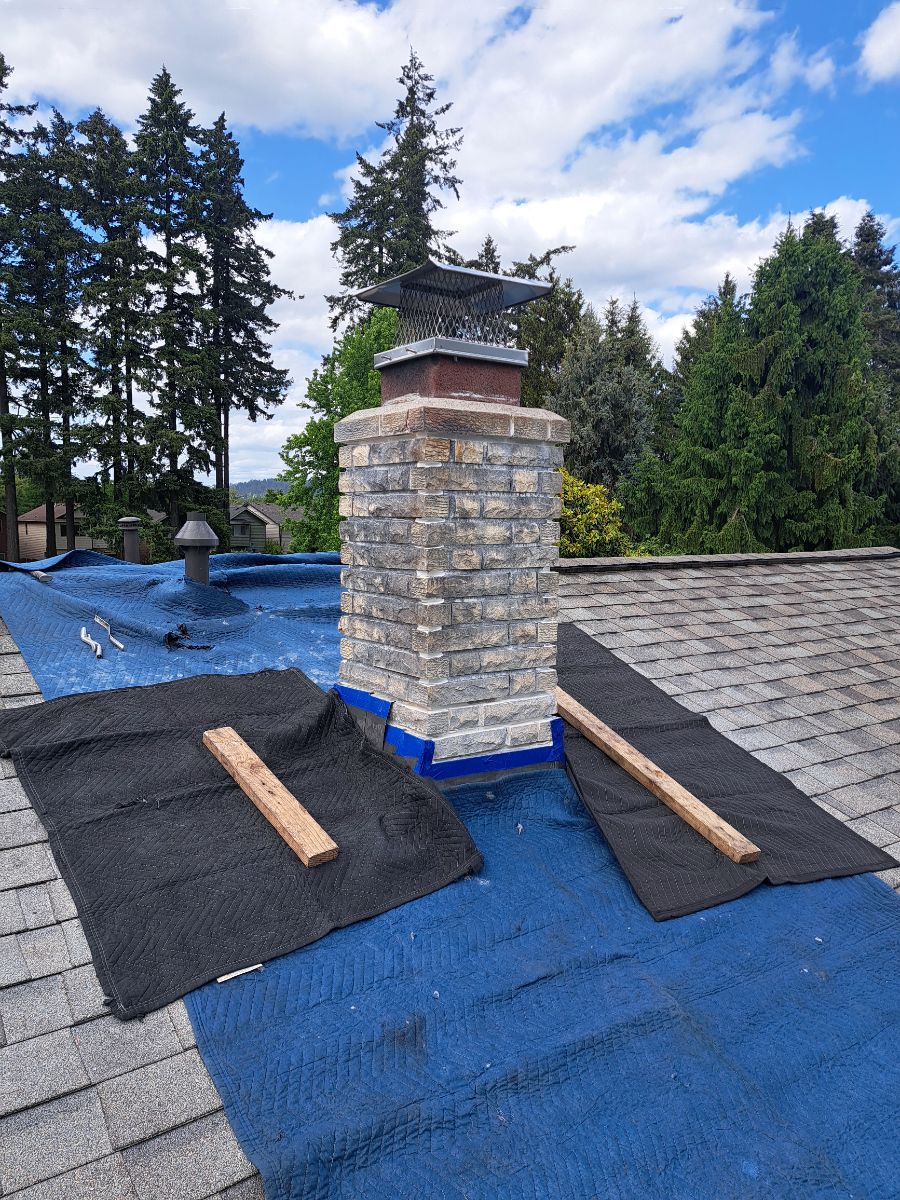 1818180235304131530.heic Chimney repair - Protecting the roof shingles