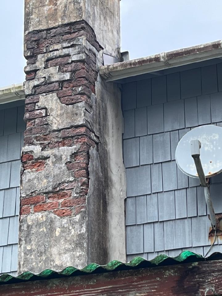IMG_1586.jpg Chimney with freeze and water damage caused by coastal weather.