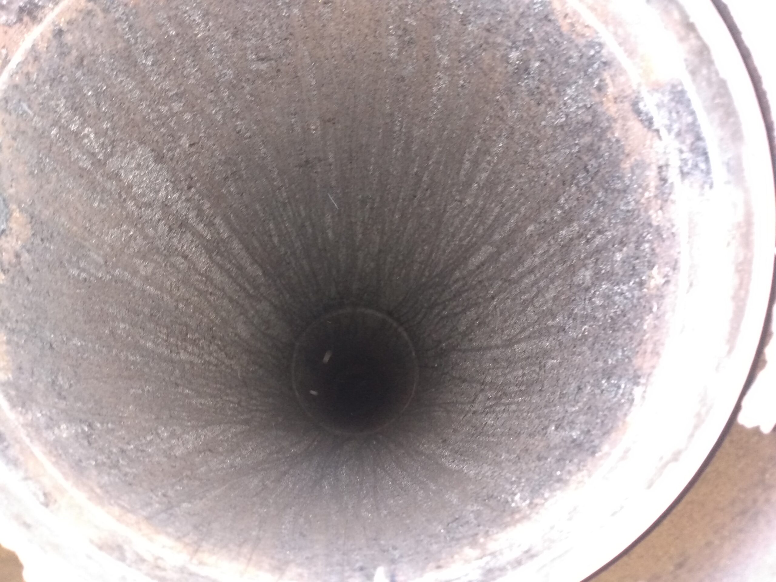 IMG_20210209_154918846 Vacumming out creosote from the top of a chimney during the chimney cleaning process. Portland, Oregon