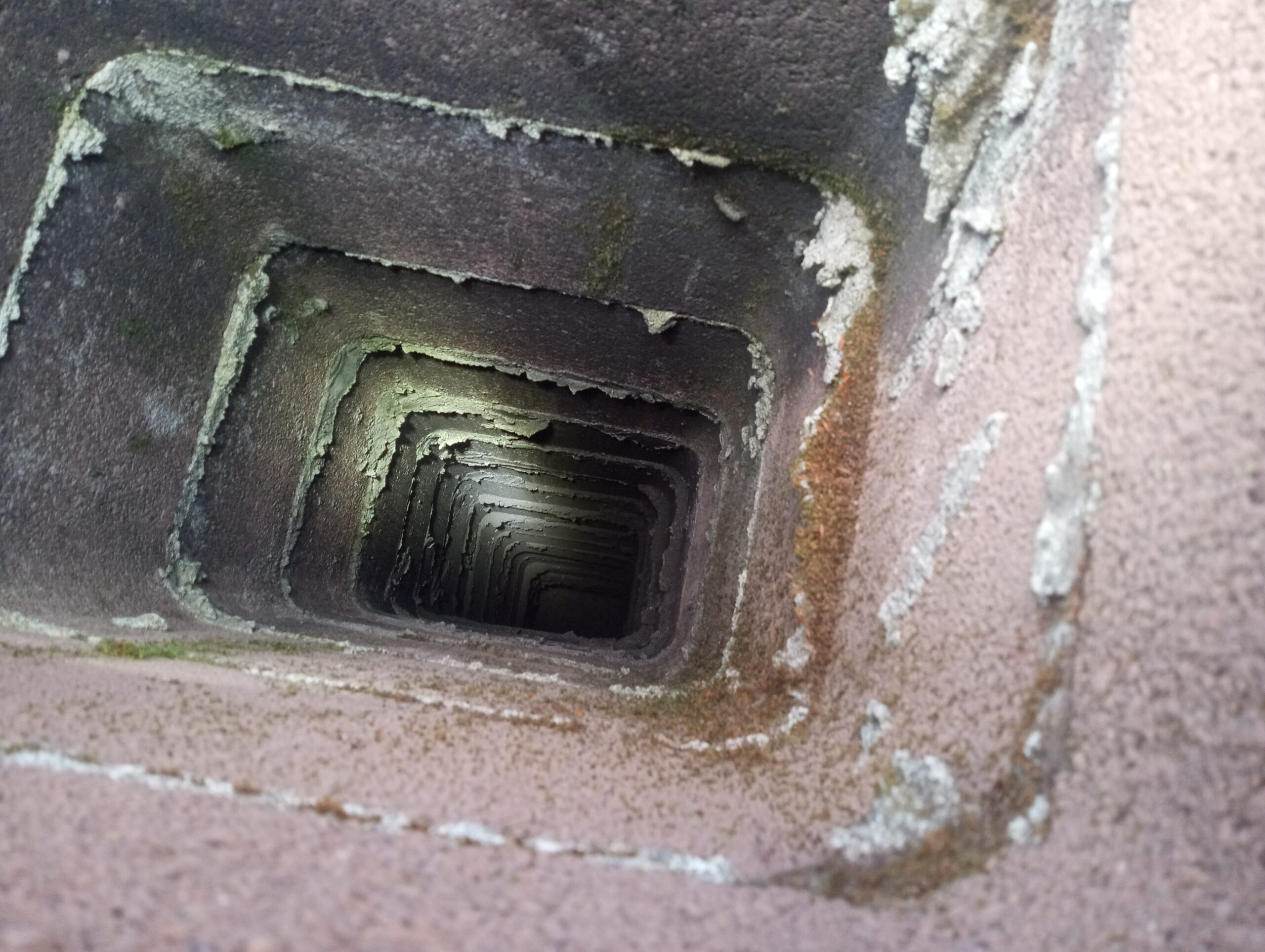 IMG_20240522_102435630_BURST000_COVER(1) Woodstove fireplace insert removal for chimney cleaning. Portland Oregon.