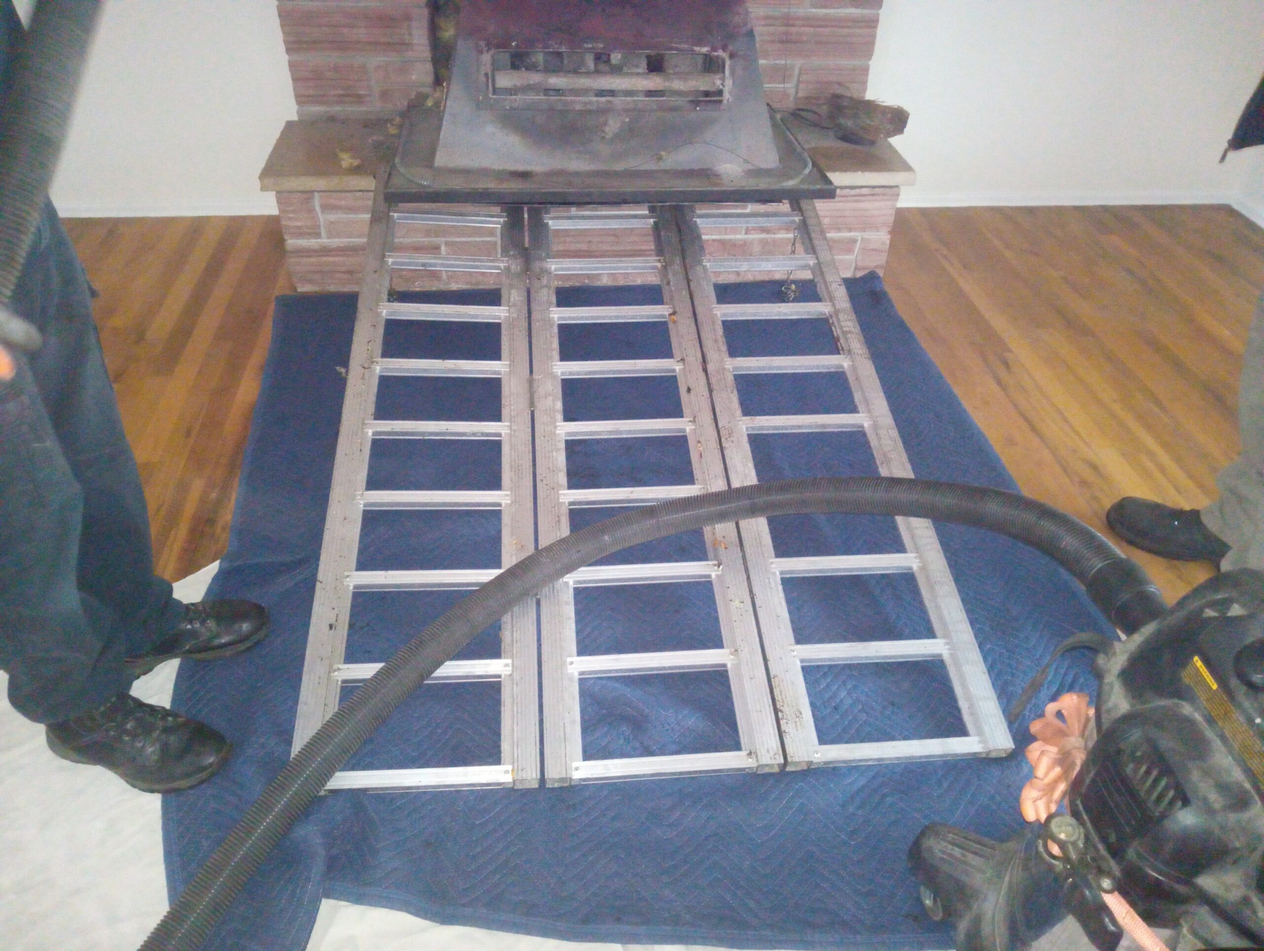 Woodstove fireplace insert removal for chimney cleaning. Portland Oregon. Woodstove fireplace insert removal for chimney cleaning. Portland Oregon.