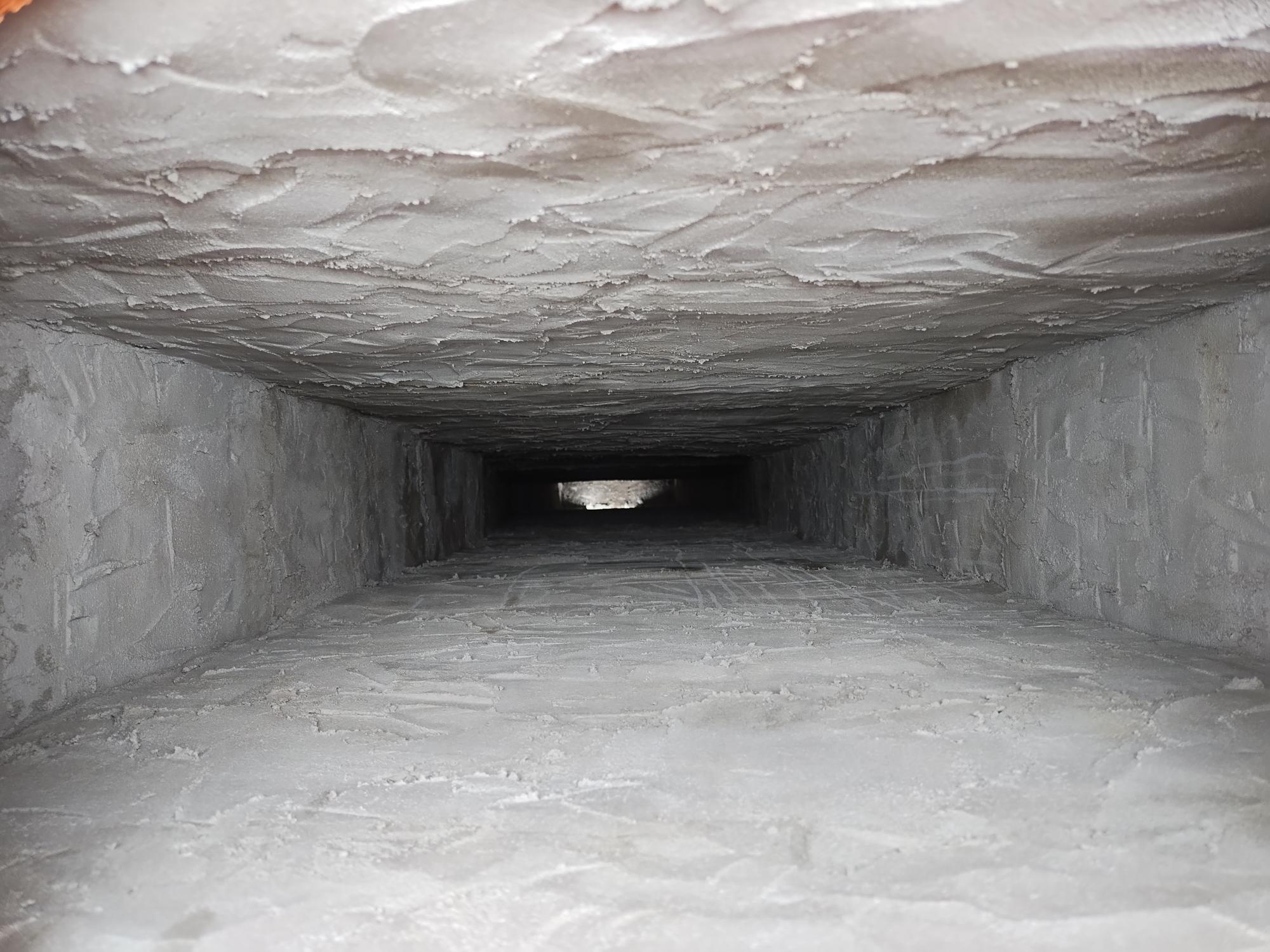 Entire inside of a chimney flue, newly re-coated with mortar.